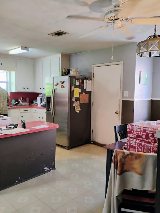 526 Guyer St, Sugar Land, TX 77498 - kitchen with stainless steel fridge, ceiling fan, and white cabinetry