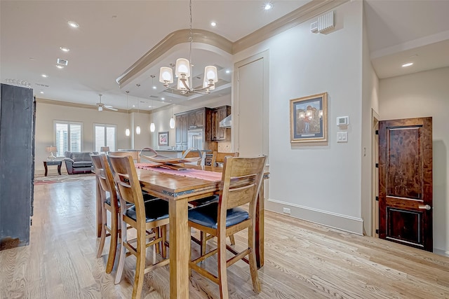 311 Calle Sevilla Pl, Houston, TX 77007 - dining room featuring light wood-style flooring, a chandelier, ornamental molding, ceiling fan, and baseboards