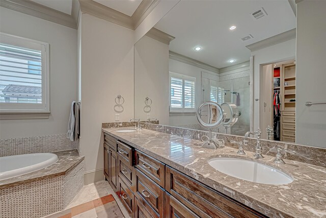 311 Calle Sevilla Pl, Houston, TX 77007 - bathroom with crown molding, a shower stall, double vanity, a walk in closet, and a bath