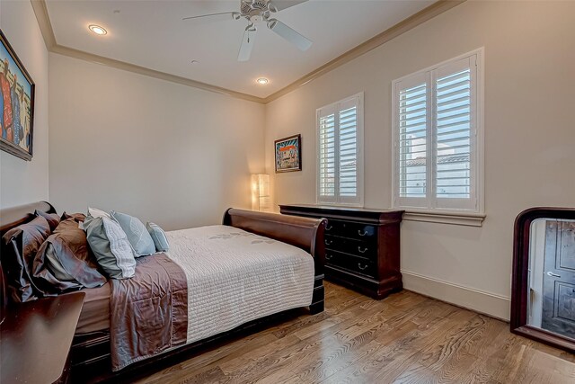 311 Calle Sevilla Pl, Houston, TX 77007 - bedroom with crown molding, wood finished floors, baseboards, and ceiling fan