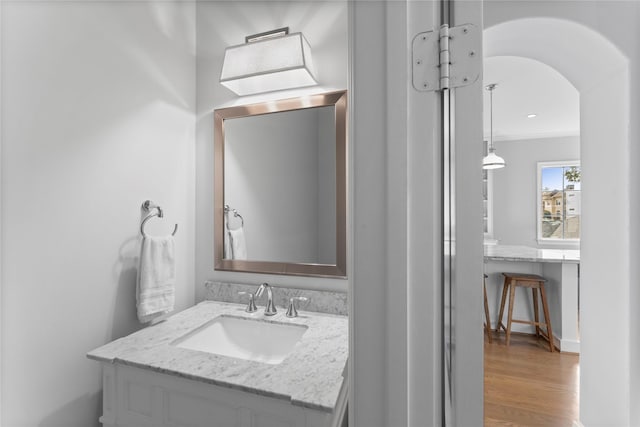 1705 Michigan St, Houston, TX 77006 - bathroom with vanity, wood finished floors, and crown molding