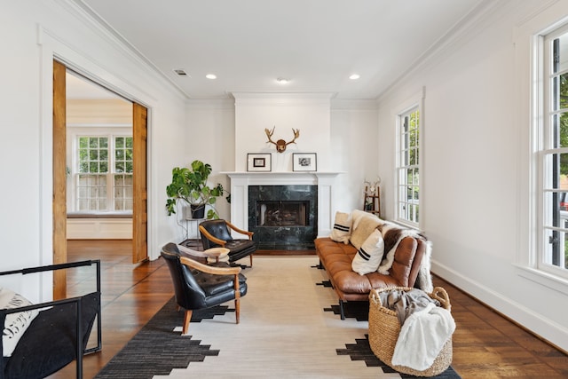 613 E 18th St, Houston, TX 77008 - living room with ornamental molding, a fireplace, wood finished floors, baseboards, and recessed lighting