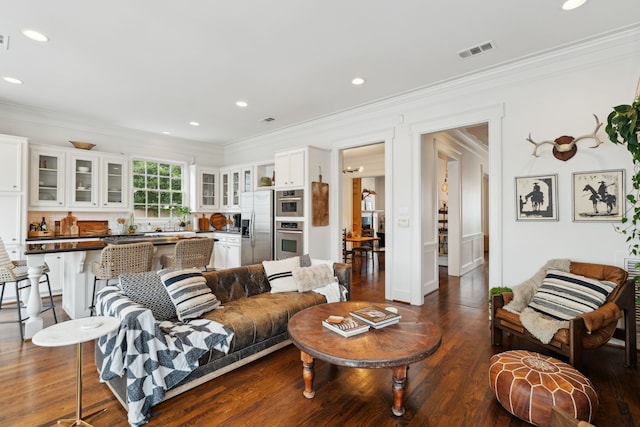 613 E 18th St, Houston, TX 77008 - living area featuring crown molding, dark wood-type flooring, and recessed lighting