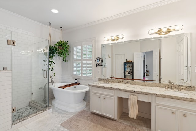 613 E 18th St, Houston, TX 77008 - full bath featuring double vanity, a shower stall, a soaking tub, ornamental molding, and tile walls