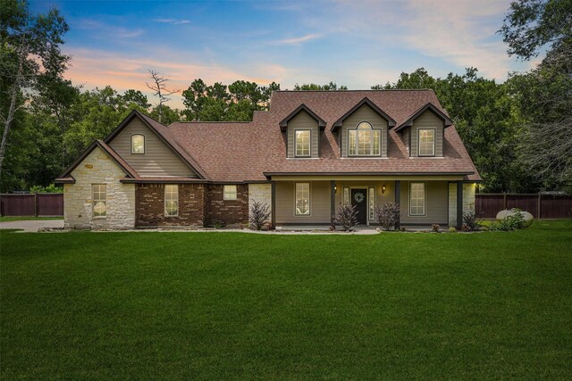 532 County Road 632, Dayton, TX 77535 - view of front of home with a shingled roof and a porch
