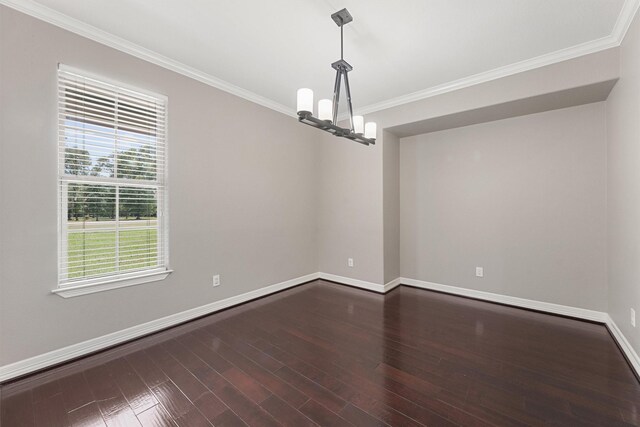 532 County Road 632, Dayton, TX 77535 - empty room featuring ornamental molding, dark wood-style floors, baseboards, and a chandelier