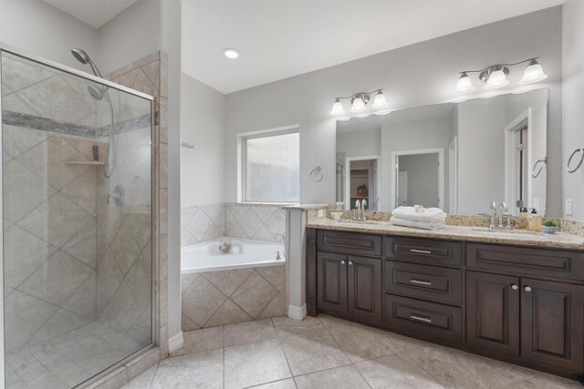 532 County Road 632, Dayton, TX 77535 - bathroom featuring double vanity, a garden tub, a shower stall, and tile patterned flooring