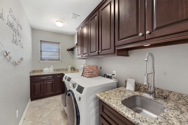 532 County Road 632, Dayton, TX 77535 - laundry room with cabinet space, separate washer and dryer, light tile patterned floors, and baseboards