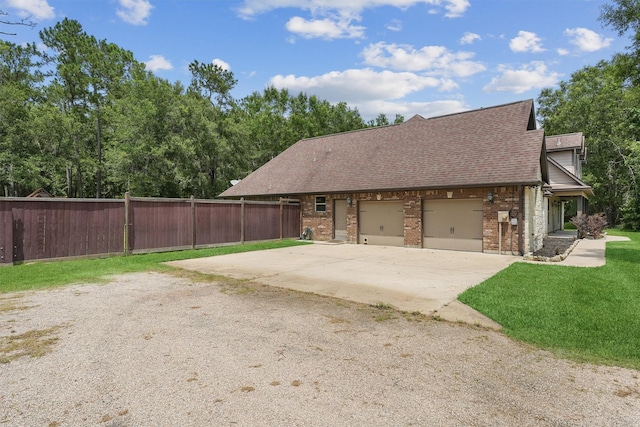 532 County Road 632, Dayton, TX 77535 - view of front of house featuring brick siding, roof with shingles, driveway, and an attached garage