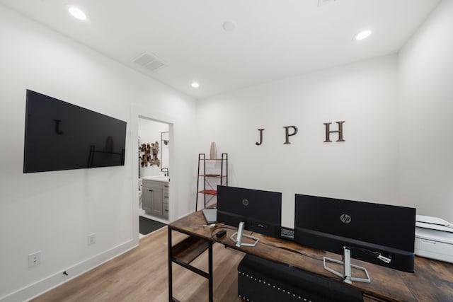 1503 Evelyn St, Houston, TX 77009 - home office with wood finished floors, baseboards, and recessed lighting
