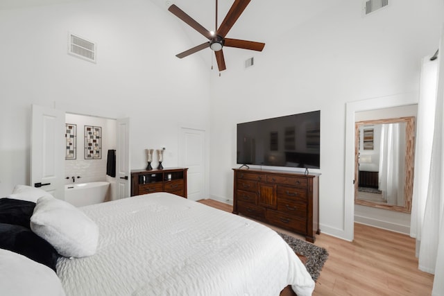 1503 Evelyn St, Houston, TX 77009 - bedroom featuring high vaulted ceiling, light wood-type flooring, baseboards, and a ceiling fan