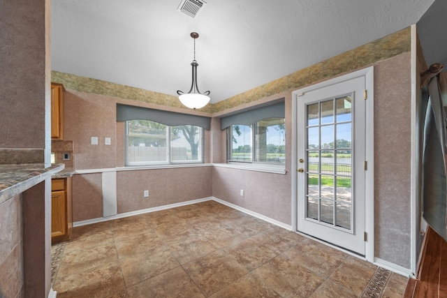 2723 Shelby Dr, Pearland, TX 77584 - unfurnished dining area featuring baseboards