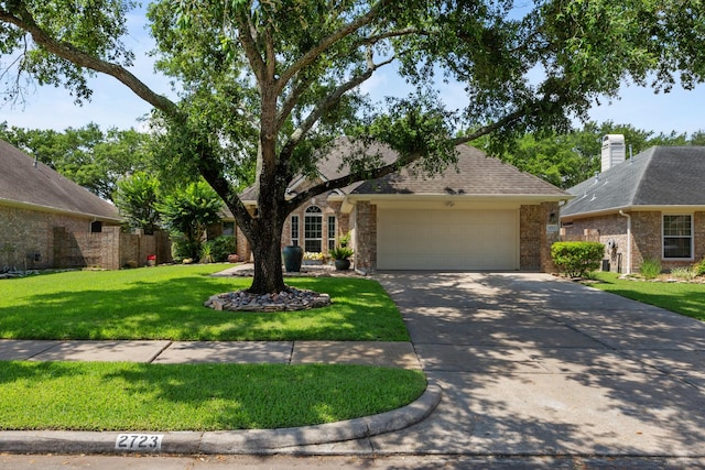 2723 Shelby Dr, Pearland, TX 77584 - view of front of property featuring an attached garage, a front yard, and driveway