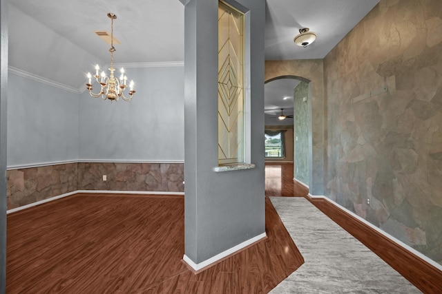 2723 Shelby Dr, Pearland, TX 77584 - hall with wood finished floors, arched walkways, baseboards, crown molding, and a chandelier