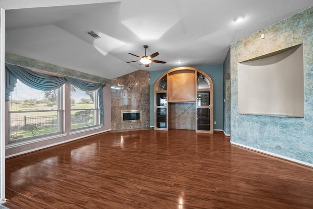 2723 Shelby Dr, Pearland, TX 77584 - unfurnished living room with wood finished floors, vaulted ceiling, a fireplace, baseboards, and ceiling fan