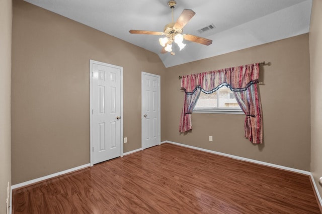 2723 Shelby Dr, Pearland, TX 77584 - unfurnished bedroom with baseboards, wood finished floors, vaulted ceiling, and ceiling fan