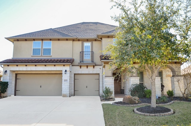 2109 Sunset Terrace Ln, Houston, TX 77089 - view of front facade with an attached garage, concrete driveway, a balcony, and stucco siding