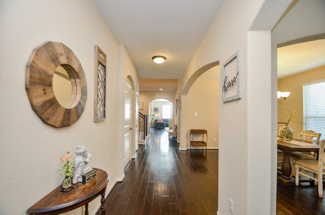 2109 Sunset Terrace Ln, Houston, TX 77089 - hall featuring arched walkways, dark wood-type flooring, and baseboards