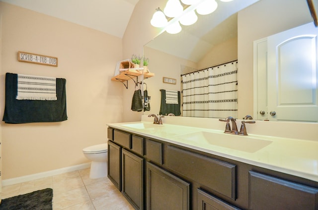 2109 Sunset Terrace Ln, Houston, TX 77089 - full bathroom featuring lofted ceiling, double vanity, toilet, baseboards, and tile patterned flooring