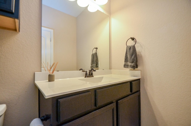 2109 Sunset Terrace Ln, Houston, TX 77089 - bathroom with vanity, toilet, and a textured wall