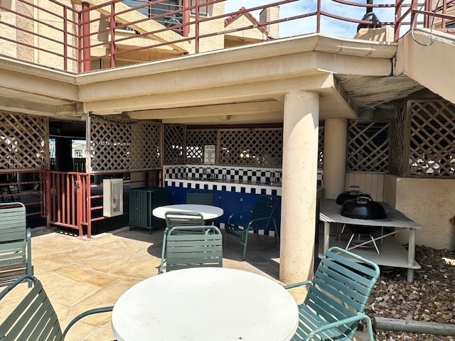 7312 Seawall Blvd Unit 216, Galveston, TX 77551 - view of patio featuring outdoor dining space