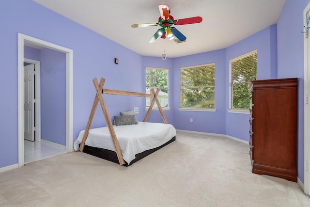 9707 Chipstead Cir, Spring, TX 77379 - bedroom with carpet floors, baseboards, and ceiling fan