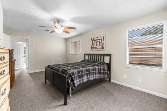 168 Bay Haven Blvd, Livingston, TX 77351 - bedroom featuring carpet, baseboards, and a ceiling fan