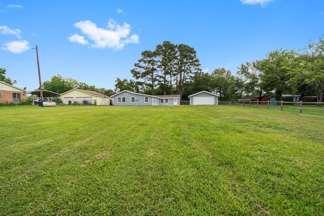 168 Bay Haven Blvd, Livingston, TX 77351 - view of yard featuring a detached garage and an outdoor structure