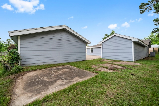168 Bay Haven Blvd, Livingston, TX 77351 - view of grassy yard with central AC and a patio area