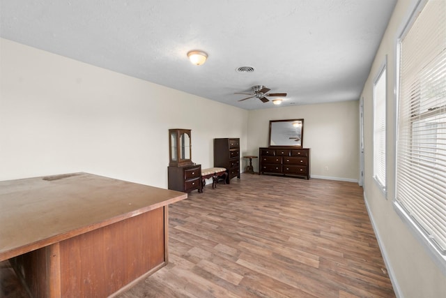 168 Bay Haven Blvd, Livingston, TX 77351 - living area with ceiling fan, wood finished floors, and baseboards