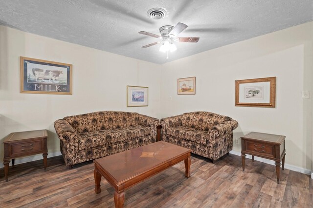 168 Bay Haven Blvd, Livingston, TX 77351 - living room with wood finished floors, ceiling fan, a textured ceiling, and baseboards