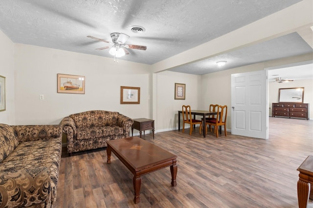 168 Bay Haven Blvd, Livingston, TX 77351 - living area with a ceiling fan, a textured ceiling, wood finished floors, and baseboards