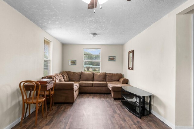 168 Bay Haven Blvd, Livingston, TX 77351 - living room with dark wood-style floors, baseboards, a textured ceiling, and ceiling fan