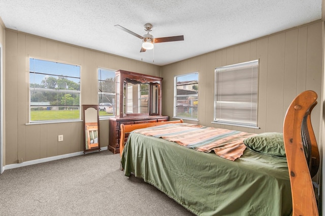 168 Bay Haven Blvd, Livingston, TX 77351 - bedroom featuring baseboards, carpet floors, a textured ceiling, and a ceiling fan