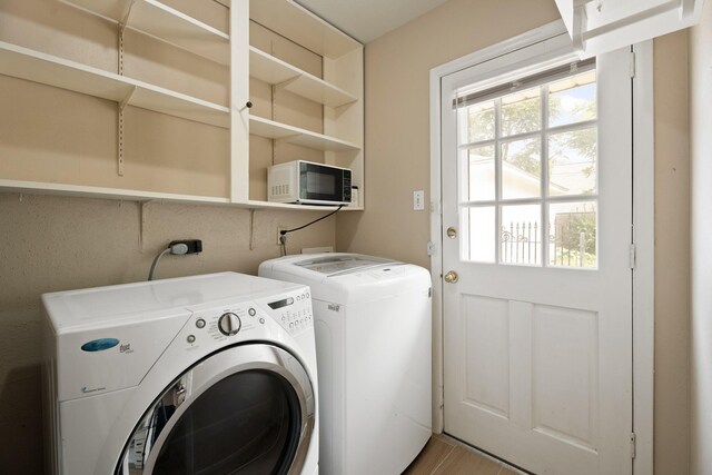 10907 Sagemeadow Ln, Houston, TX 77089 - laundry area with washer and clothes dryer