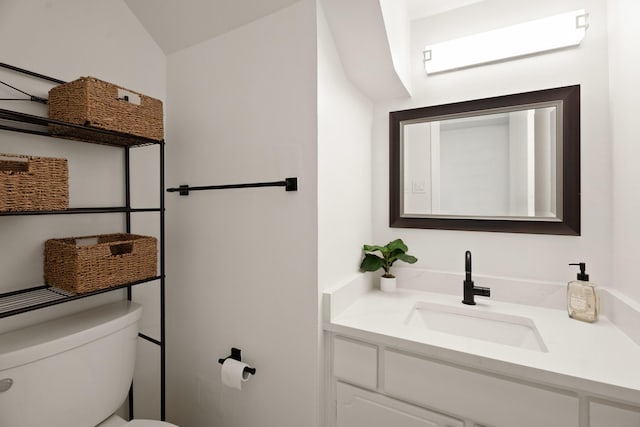 10907 Sagemeadow Ln, Houston, TX 77089 - bathroom with toilet, vanity, and lofted ceiling