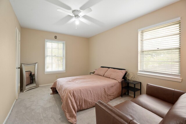 10907 Sagemeadow Ln, Houston, TX 77089 - bedroom featuring light carpet, baseboards, and ceiling fan