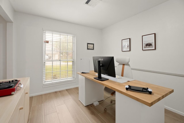 10907 Sagemeadow Ln, Houston, TX 77089 - office space featuring baseboards, healthy amount of natural light, and light wood-style flooring
