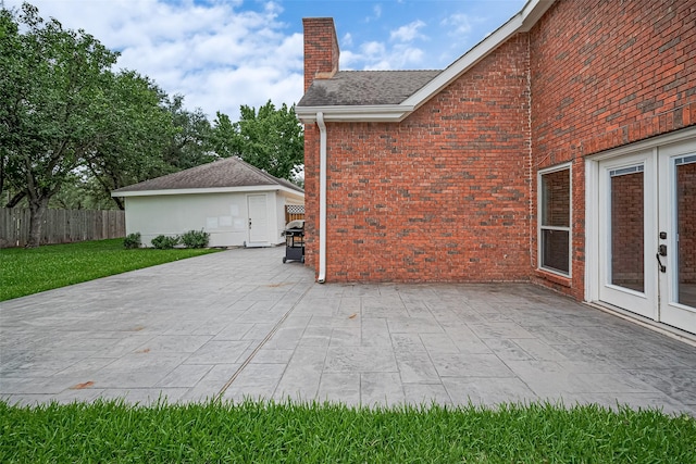 3406 Mesquite Dr, Sugar Land, TX 77479 - view of patio with french doors and a grill