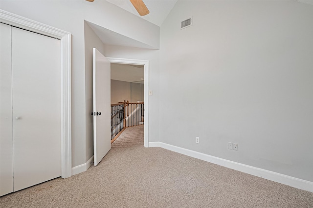 3406 Mesquite Dr, Sugar Land, TX 77479 - unfurnished bedroom with light carpet, vaulted ceiling, baseboards, and a ceiling fan