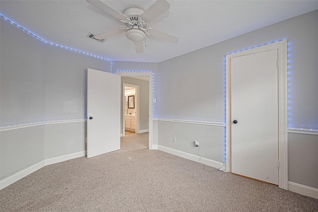3406 Mesquite Dr, Sugar Land, TX 77479 - unfurnished bedroom featuring carpet floors, baseboards, and a ceiling fan
