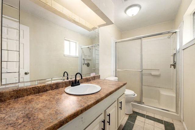8442 Lettie St, Houston, TX 77075 - bathroom featuring toilet, a shower stall, vanity, and tile patterned flooring