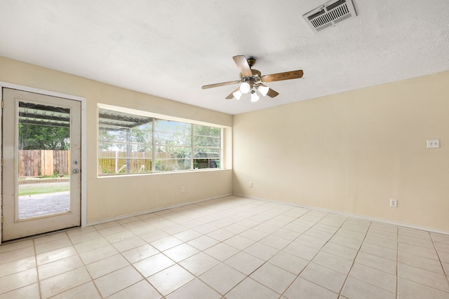 8442 Lettie St, Houston, TX 77075 - empty room featuring a ceiling fan, light tile patterned floors, and baseboards