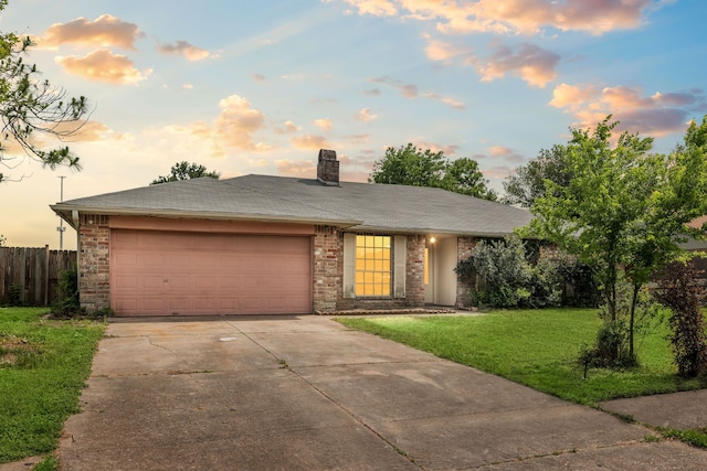8442 Lettie St, Houston, TX 77075 - view of front facade featuring concrete driveway, an attached garage, and a chimney