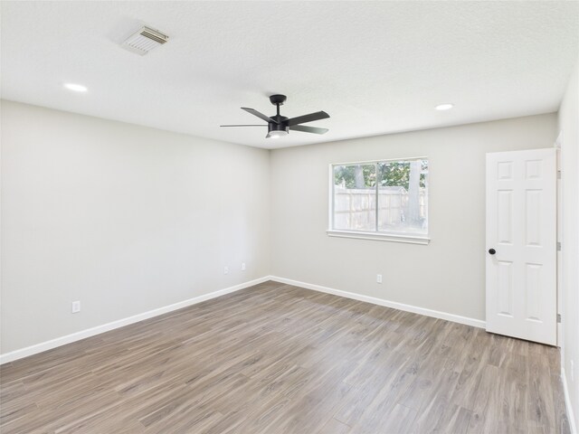 3219 Ricewood Dr, Porter, TX 77365 - unfurnished room featuring wood finished floors, baseboards, ceiling fan, and recessed lighting