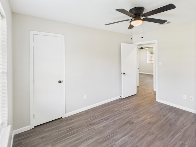 3219 Ricewood Dr, Porter, TX 77365 - spare room featuring wood finished floors, ceiling fan, and baseboards
