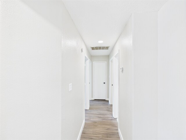 3219 Ricewood Dr, Porter, TX 77365 - hallway with baseboards, light wood finished floors, and recessed lighting