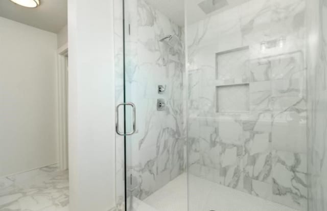 10618 Cranbrook Rd, Houston, TX 77042 - full bathroom featuring a marble finish shower and marble finish floors