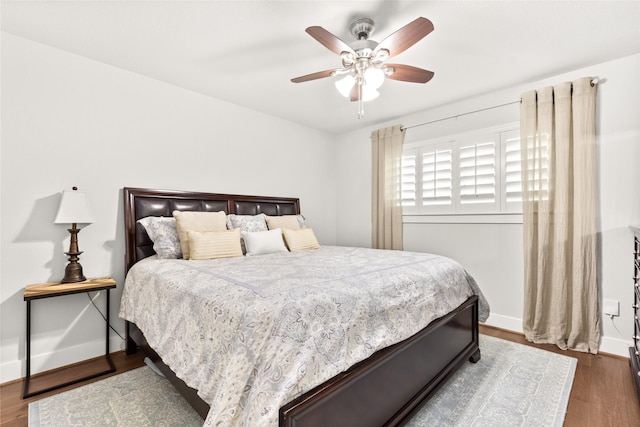 10618 Cranbrook Rd, Houston, TX 77042 - bedroom with wood finished floors, baseboards, and a ceiling fan