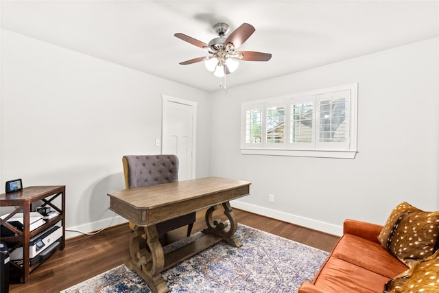 10618 Cranbrook Rd, Houston, TX 77042 - office area featuring baseboards, a ceiling fan, and dark wood-style flooring
